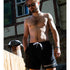Mann in Technostoff Badehose in schwarz für Festival und Sommer Großansicht